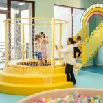 Yellow circular play structure at BlueBalloonia