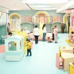 Families playing in BlueBalloonia’s pastel indoor playground