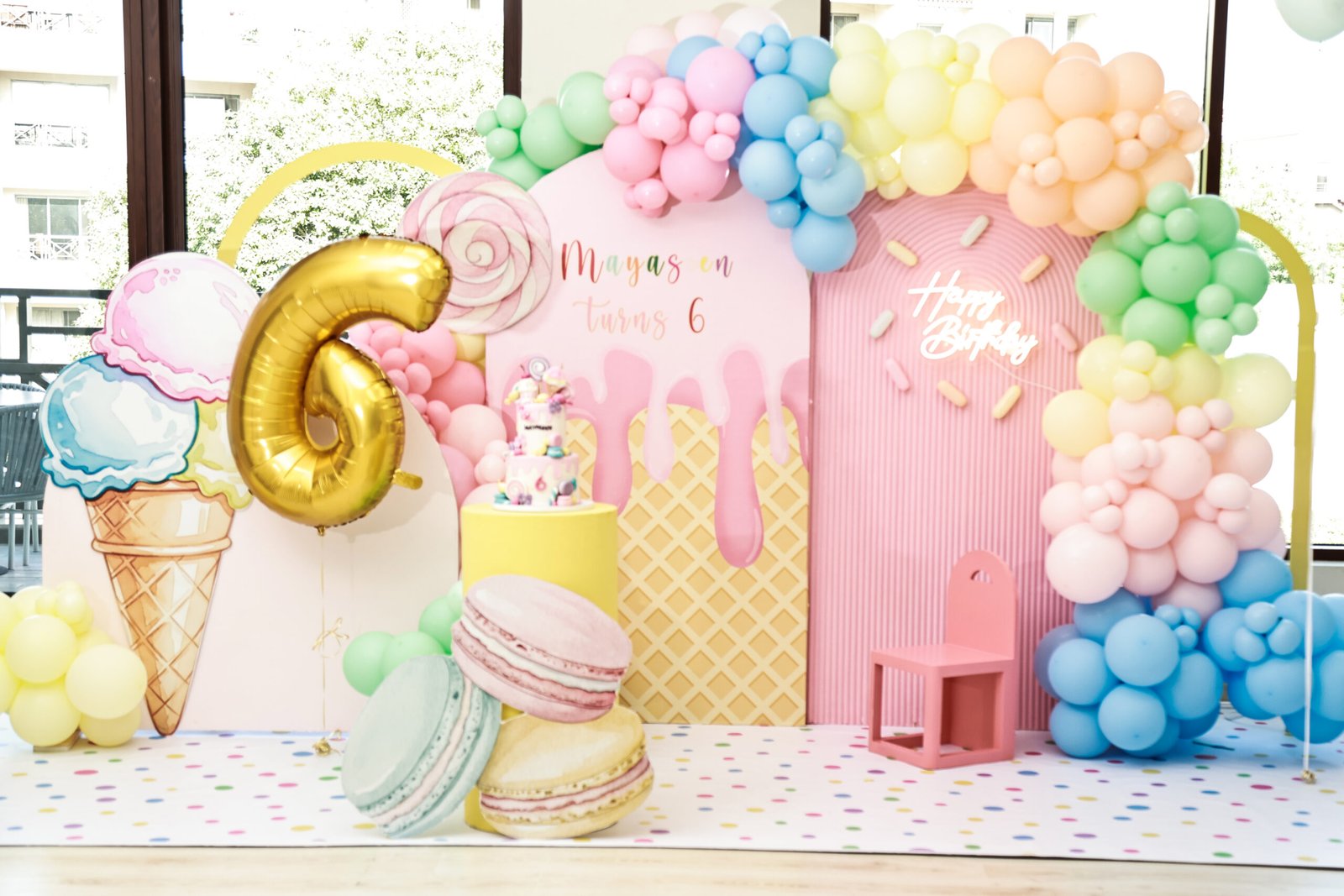 Sweet-shop backdrop with pastel balloons